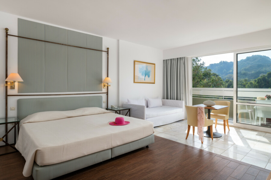 Premium Family Studio showcasing cozy bedding and inviting interior space at Dionysos Hotel.