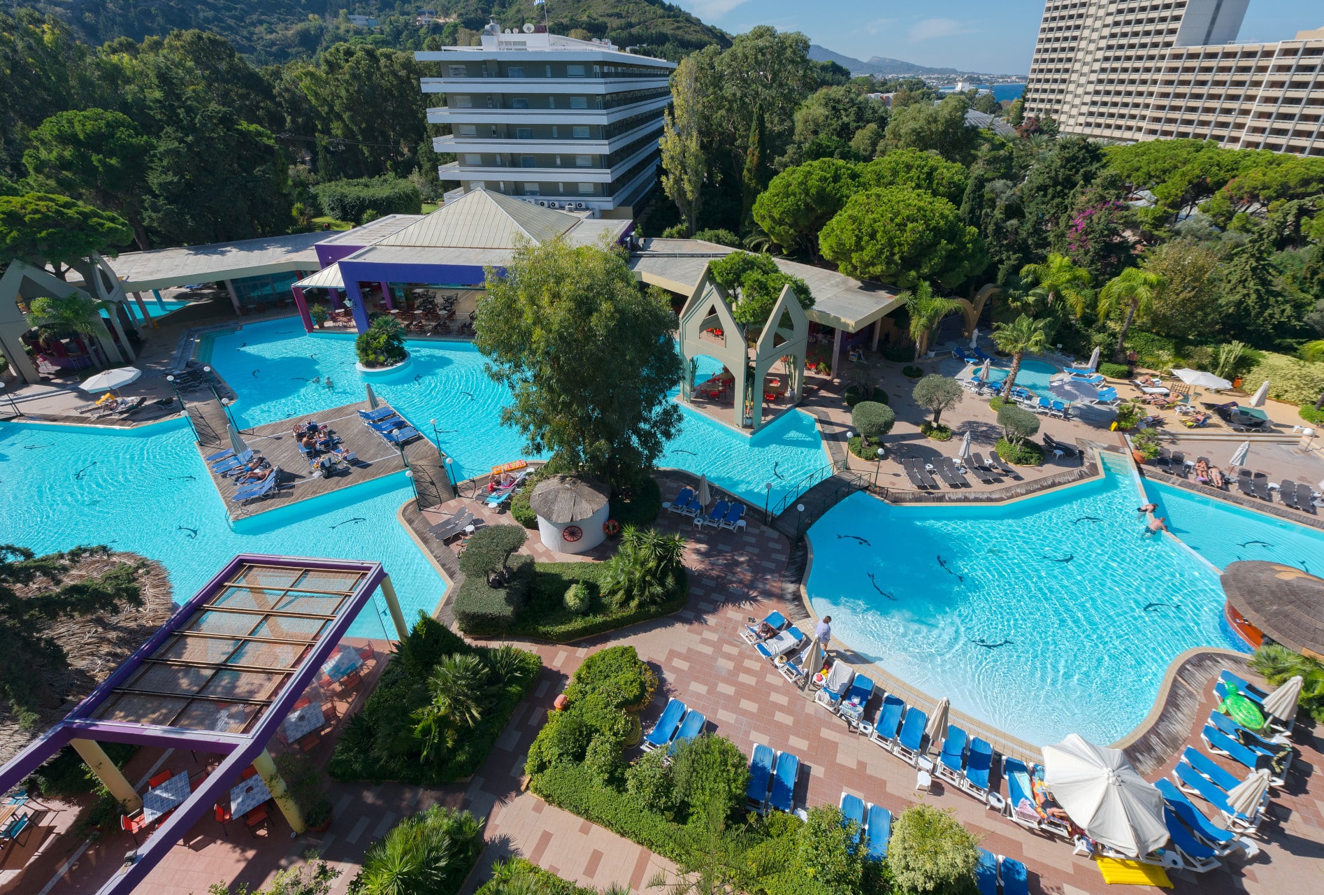 Aerial view of the seawater lagoon pools at Dionysos Hotel, an eco-friendly hotel in Rhodes